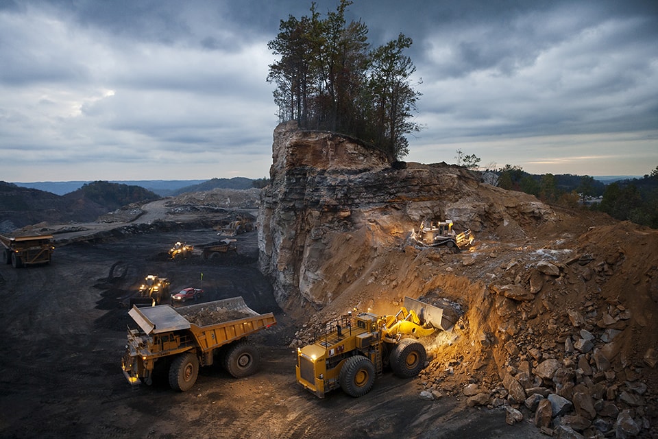 Mountaintop removal coal mine. Overburden from blasting is removed by various machines